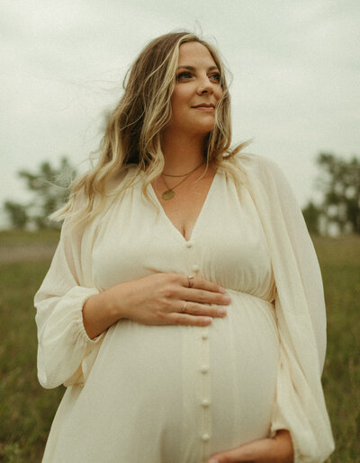 pregnant mother posing in field