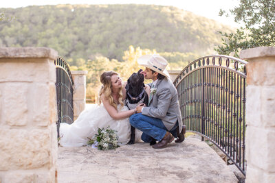 bride and groom next to dog licks groom after wedding at Milestone Boerne Texas by Firefly Photography