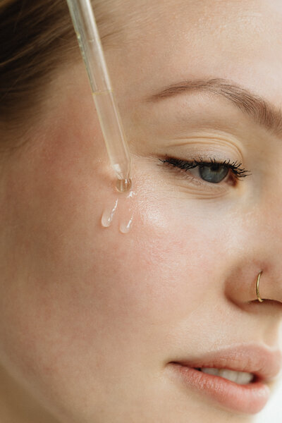 kaboompics_applying-facial-serum-for-enhanced-skin-care-32027