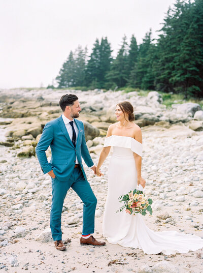 Bride and groom on a pebbly beach in Halifax Nova Scotia