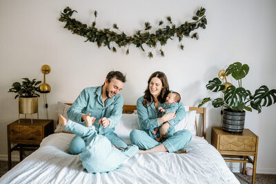 Family in pajamas with holiday decor