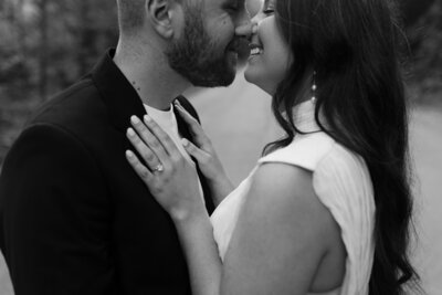man and woman smiling and kissing