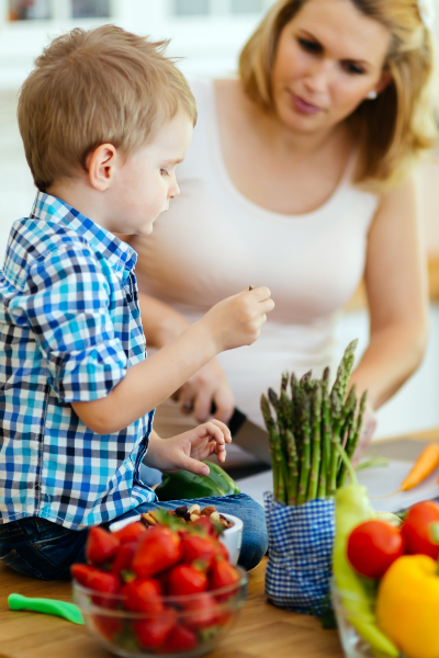 Thrive by Spectrum Pediatrics image for hour with an expert service is a child and mother preparing food together for mealtime