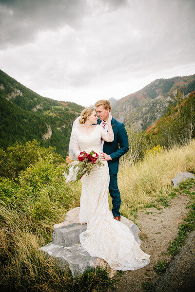 couple kissing on rock after adventurous Jackson Hole elopement