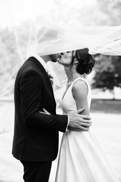 Bride and groom kiss for photos at Princeton, NJ wedding