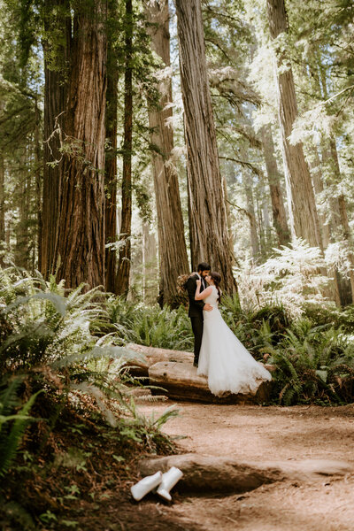 couple standing in a forest in Oregon