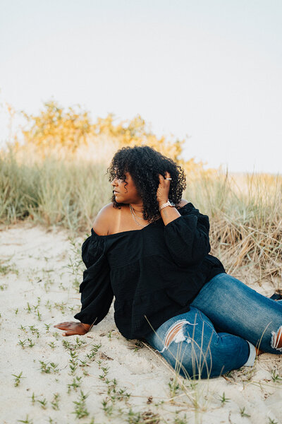 Black female on beach with curly hair