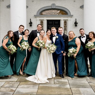 Bride and groom with their bridal party outside of Radnor Valley Country Club