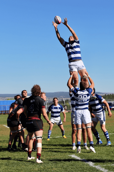 USAFA Men's player catching rugby ball - Zoomie Rugby