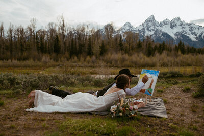 Couple enjoying painting activity in their elopement captured by Nicole Adrianna Photography