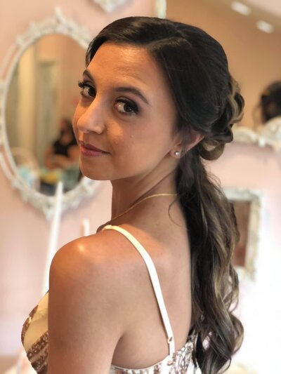teenage girl ready for prom looking over shoulder