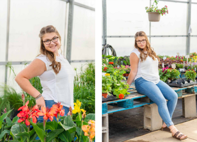 high school senior girl posing in a greenhouse wearing a white shirt and blue jeans