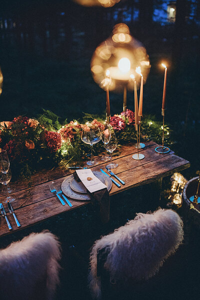A beautiful wedding supper table ready for guests in the forest of Swedish Lapland.