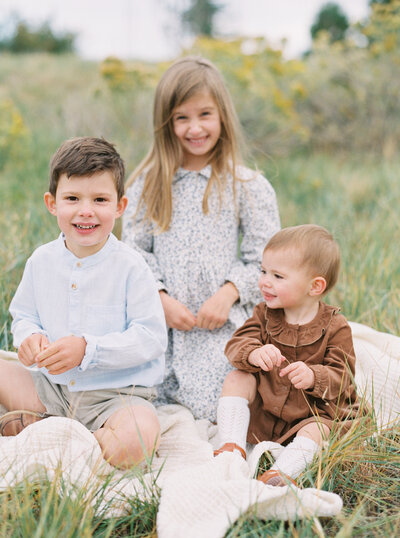 Family photographer in Denver featuring kids and children at the beach.