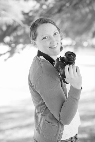 Seattle Wedding Photographer captures photographer smiling holding camera
