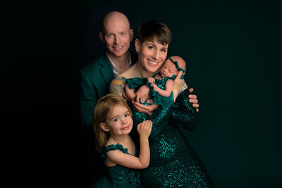 Elevated family newborn portrait photographed in Seattle, capturing parents with their newborn and toddler in a refined, artful style for families who want the highest level of photography for their most important moments.