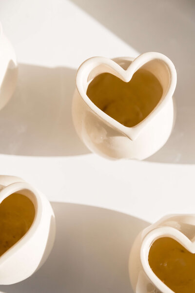 A heart-shaped ceramic bowl on a white background.