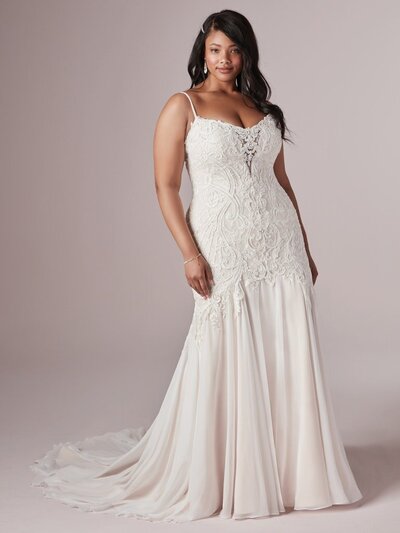 Beaded and appliqued with elegant finishes, this strapless gown is utterly timeless.