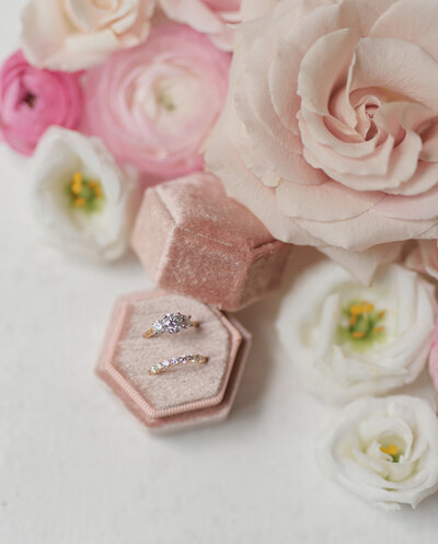 beautiful pink and white florals with brides engagement ring in velvet box for a fairmont wedding in boston.