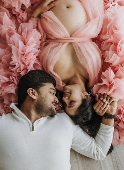 Maryland Maternity Photographer studio image of model in pink ruffled robe