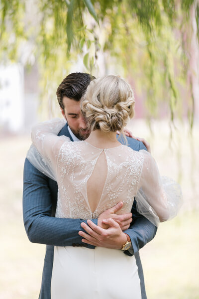 bride and groom hugging