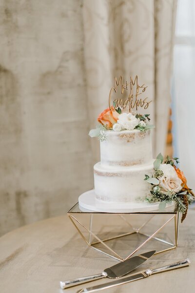 three tier wedding cake on a table