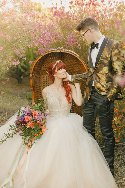Fairytale portrait session of couple in a flower garden on a farm styled shoot