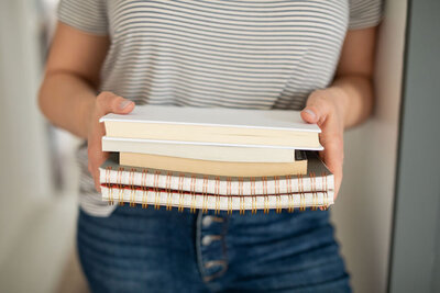 Allea Grummert, email copywriter, holds her favorite books