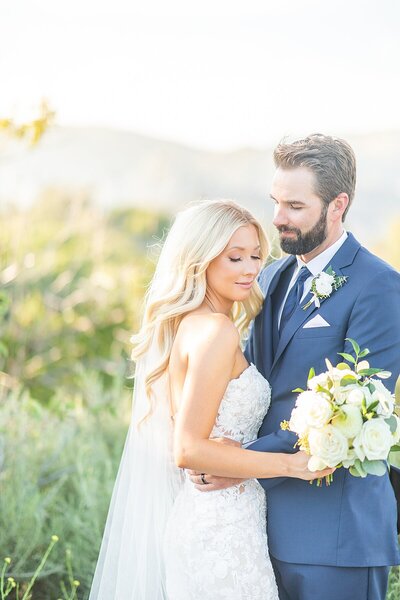 Bride and groom on the mountaintop at Circle Oak Ranch in Fallbrook, California by Sherr Weddings, San Diego Photography and Videography team.