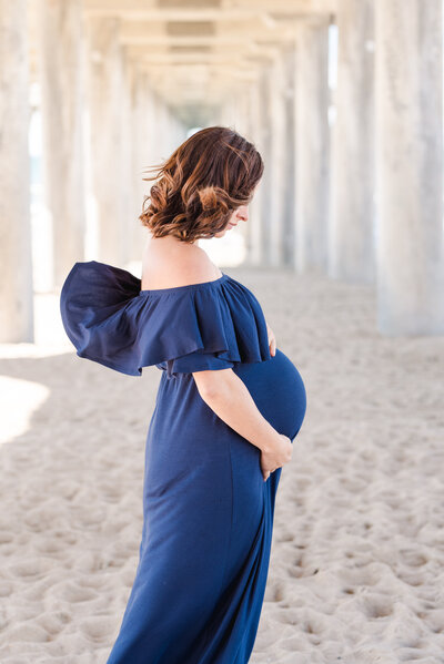 Pregnancy photoshoot, taken in Lake Forest, California by Amy Captures Love at Huntington Beach Pier