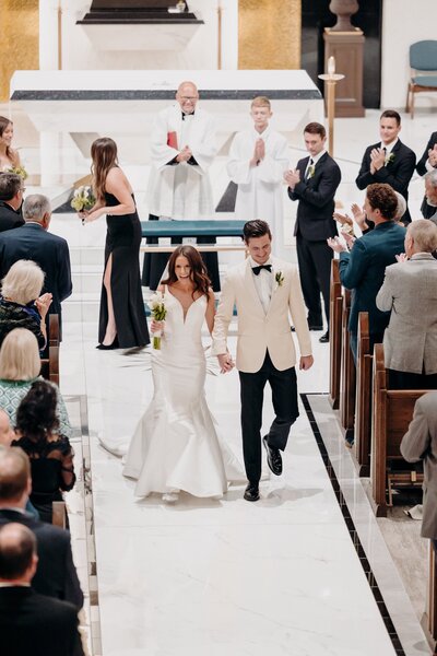 Bride and Groom exiting aisle and celebrating