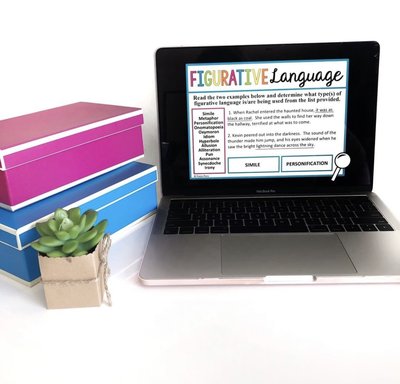 A figurative language presentation appears on a computer beside two boxes and a plant.