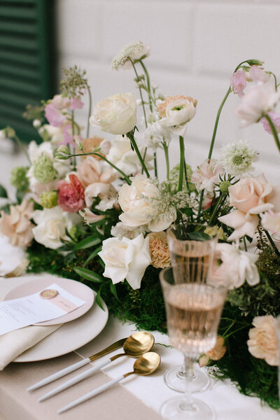 Wedding reception tablescape with lush floral centerpieces