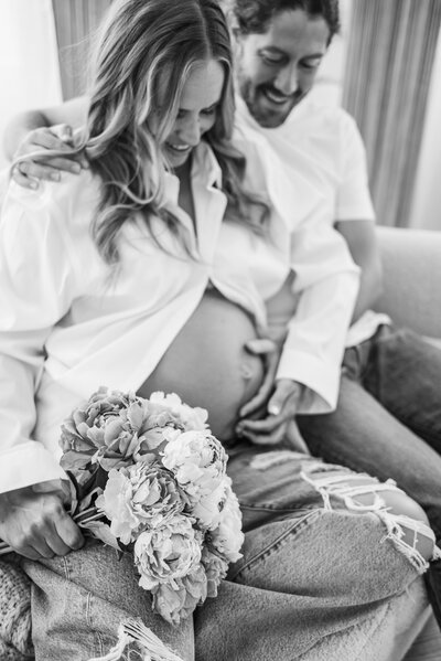 Mom and Dad looking down and pregnant belly in Atlanta Maternity session.
