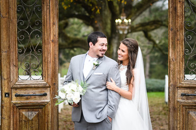 Couple under arch at  The Venue at Southern Oaks Farm, Gulfport, MS, Mississippi Wedding