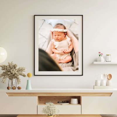 framed newborn photo of baby girl in mothers arm captured by Springfield MO newborn photographer The XO Photography