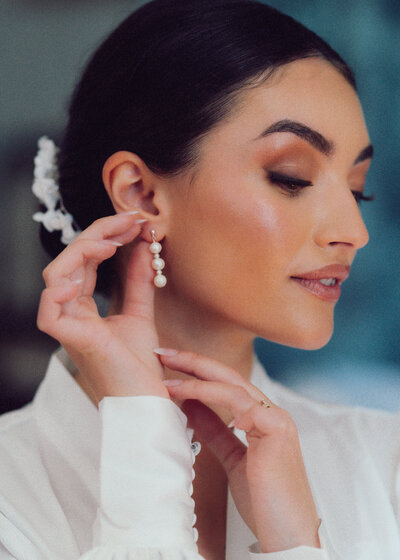 Modern bride posing with poise and elegance, her wedding gown highlighting her unique sense of style in a breathtaking backdrop