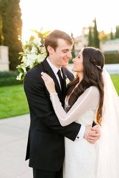 all white tented modern glam wedding with gold chairs
