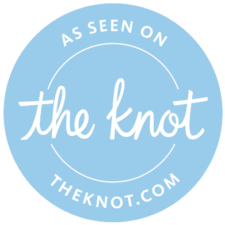 baby blue and white logo for the knot dot com. The logo is transparent.