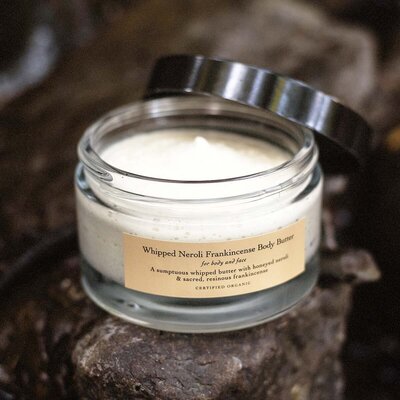 Two bottles of Primally Pure Citrus + Vanilla deodorant on a gray surface