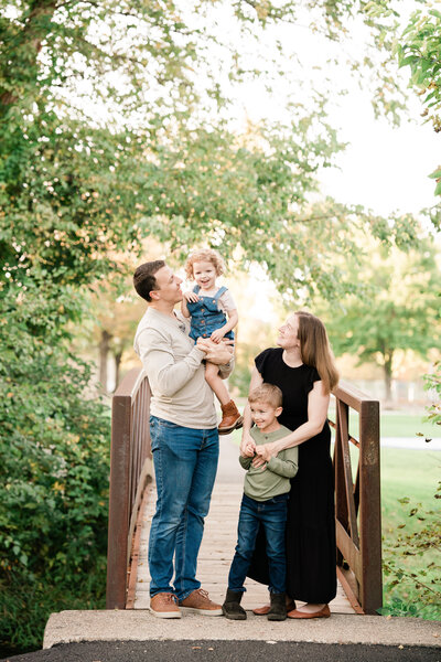 Family of three photo session with a one year old boy, and his parents at the Historic Smithville Mansion . by Renee Ash Photography