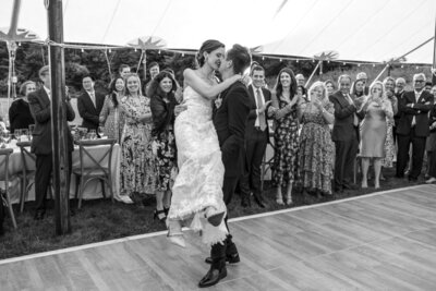 Groom lifting bride while dancing, Buxton School Wedding