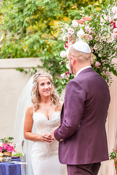 A Groom Kisses the hand of his Bride in Denver Colorado Wedding