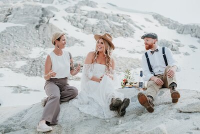 newlyweds having picnic on top of Whistler mountains