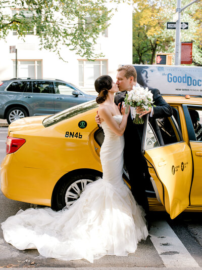 Bride and Groom with yellow taxi