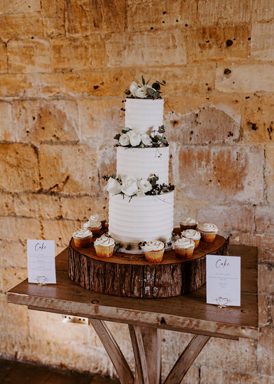 Elegant white wedding cake with fresh flowers