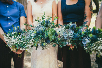 Bridal party holds their succulent filled wedding bouquets