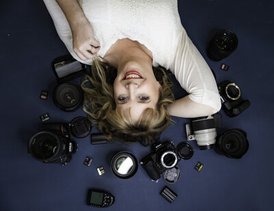 Grand Teton wedding photographer captures photographer laying on cameras during headshots