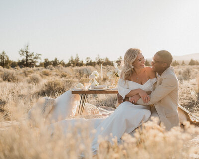 Couple enjoying a picnic during their outdoor elopement