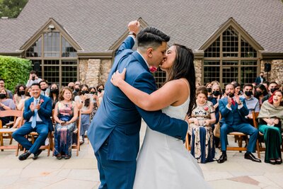 bridal couple shares first kiss